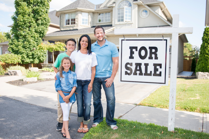 For sale sign with happy family